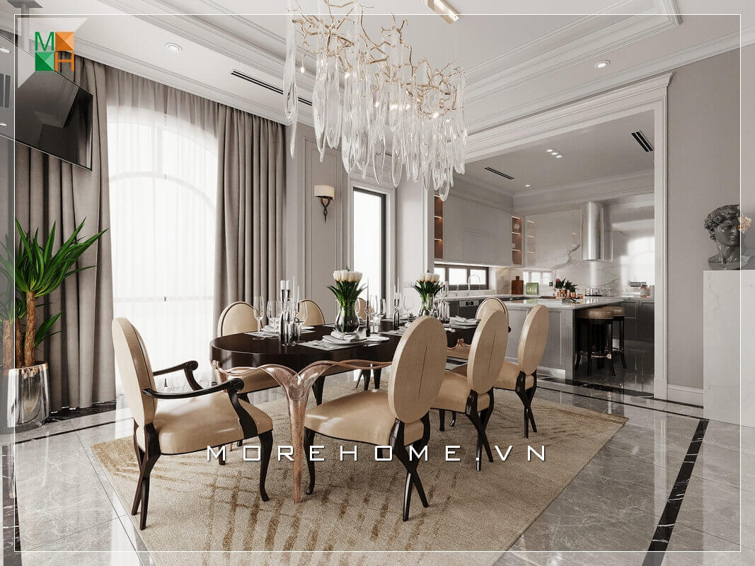 Thiết kế không gian phòng bếp liền phòng ăn rất rộng rãi và thoáng mát, sử dụng đèn chùm treo giữa không gian bàn ăn mang đậm chút tân cổ điện rất đẳng cấp. Thiết kế nội thất phòng ăn biệt thự